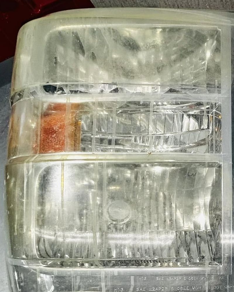 Yellowed, hazy truck headlight before headlight restoration